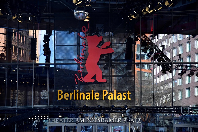 A picture taken on February 14, 2018 in Berlin shows the Berlinale film festival logo, featuring a bear, displayed on the facade of the Berlinale Palace, the main venue of the festival, on the eve of the opening of the 68th edition. u00e2u20acu201d AFP pic