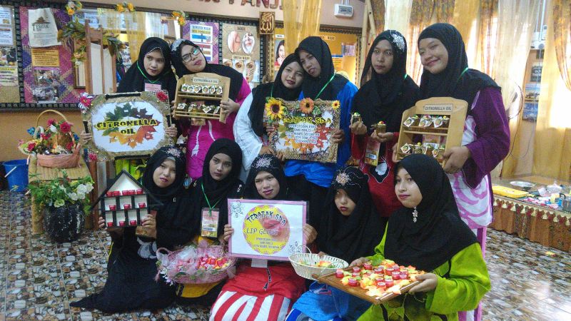 Razhiyah's children display the products they had made via their skill training.