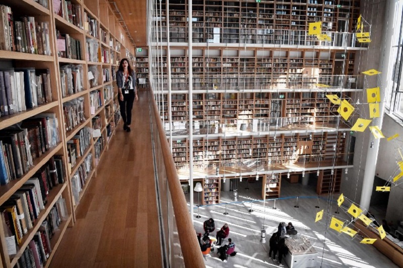 People sit and walk at the new home of the National Library of Greece, at the Stavros Niarchos Foundation Cultural Centre, in Athens February 6, 2018. u00e2u20acu2022 AFP pic