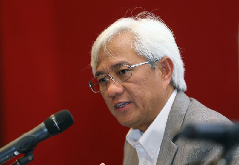 Axiata Group Chief Executive Officer Tan Sri Jamaludin Ibrahim speaks during a press conference in Kuala Lumpur February 22, 2018. u00e2u20acu201d Picture by  Abdul Razak Ghazali