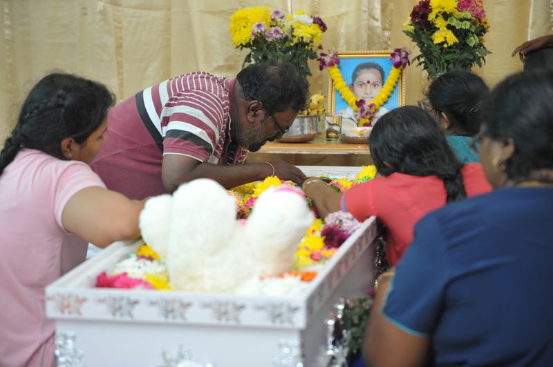 R. Muniandy giving a goodbye kiss to his daughter Vasanthapiriya during the wake in their home at Kampung Tong Hai, Nibong Tebal, Penang, February 1, 2018. u00e2u20acu201d Picture by KE Ooi