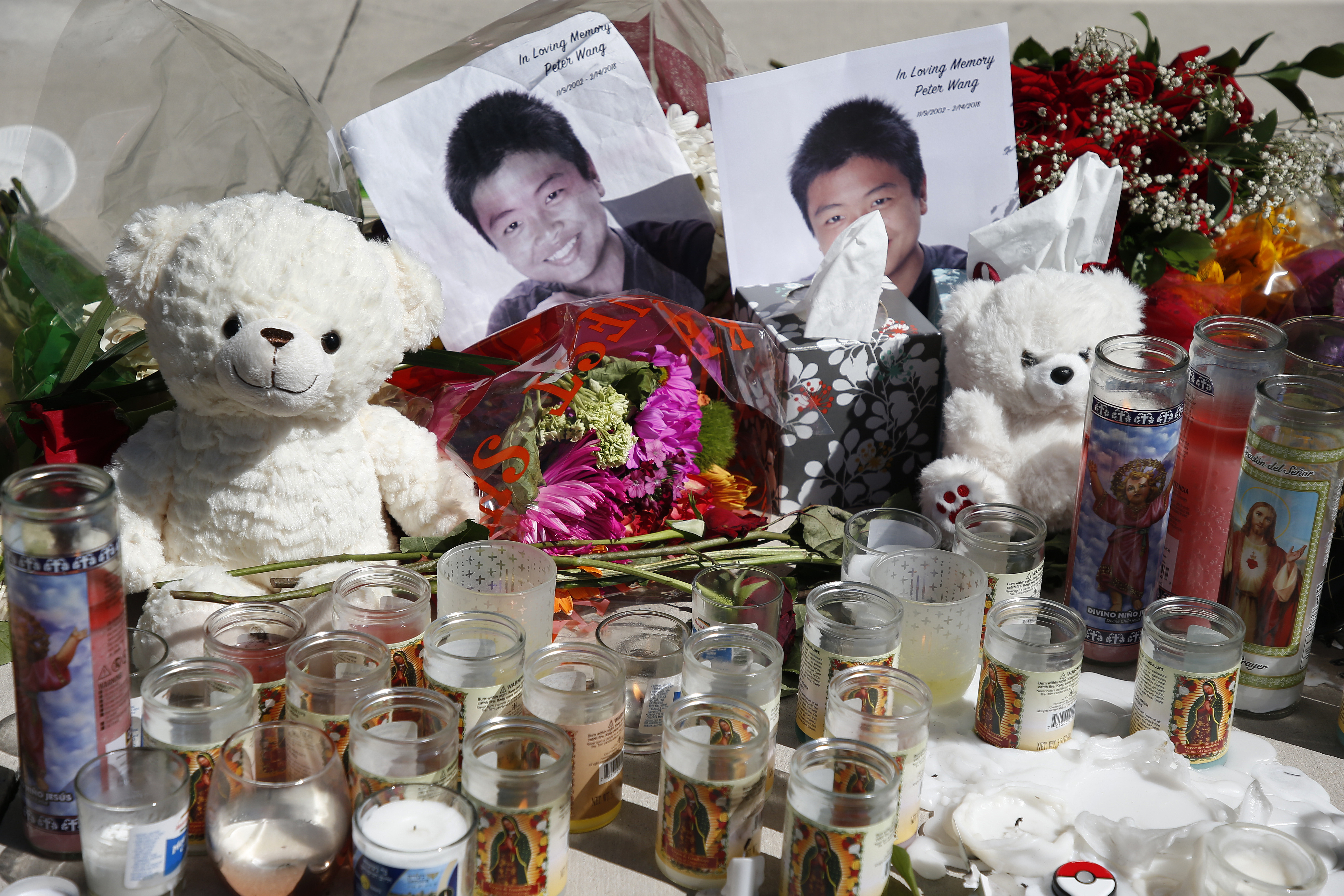 A memorial for Peter Wang, one of the victims of the Marjory Stoneman Douglas High School shooting, sits on a bandshell stage in a park in Parkland, Florida on February 16, 2018. u00e2u20acu201d AFP pic  