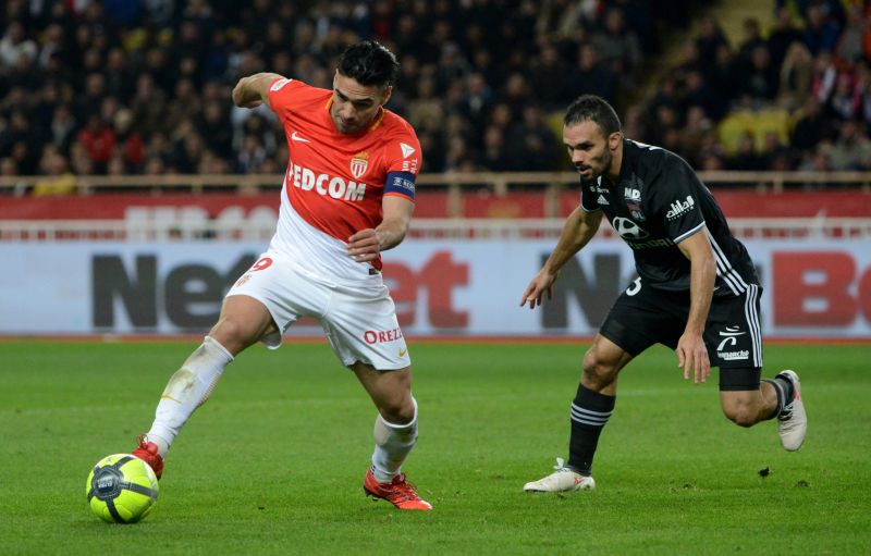 Monaco's Radamel Falcao (left) in action with Lyon's Jeremy Morel. u00e2u20acu201d Reuters pic