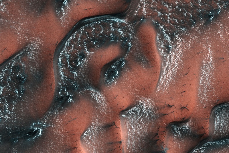 This Nasa file handout image obtained August 24, 2017, created on May 21, 2017 at 13:21 local Mars time by the High Resolution Imaging Science Experiment (HiRISE) camera on Nasau00e2u20acu2122s Mars Reconnaissance Orbiter, shows snow and ice accumulated during Winter