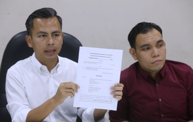 Fahmi Fadzil (left) addresses members of the media during a press conference at the Lembah Pantai Parliamentary Office, Kuala Lumpur February 7, 2018. u00e2u20acu201d Picture by Zuraneeza Zulkifli