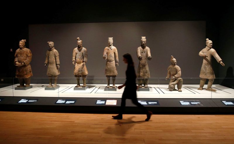 A member of the museum staff walks past a display of Terracotta Warriors which guards the tomb of Chinau00e2u20acu2122s First Emperor, Qin Shi Huang, on loan from China in The World Museum, Liverpool February 6, 2017. u00e2u20acu201d Reuters pic 