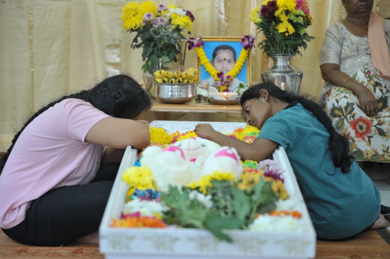 Vasanthapiriyau00e2u20acu2122s sister, Hemapriya (right) and cousin, K. Tamilarasi sit next to the open casket during the wake in their home at Kampung Tong Hai, Nibong Tebal February 1, 2018. u00e2u20acu201d Picture by KE Ooi