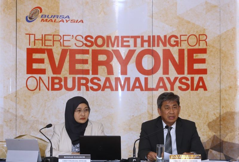 Rosidah Baharom Chief Financial Officer (left) and Datuk Seri Tajuddin Atan Chief Executive Officer of Bursa Malaysia announces a RM233.0 million profit after tax for the financial year ending 2017, December 31, 2017. u00e2u20acu201d Picture by Zuraneeza Zulkifli