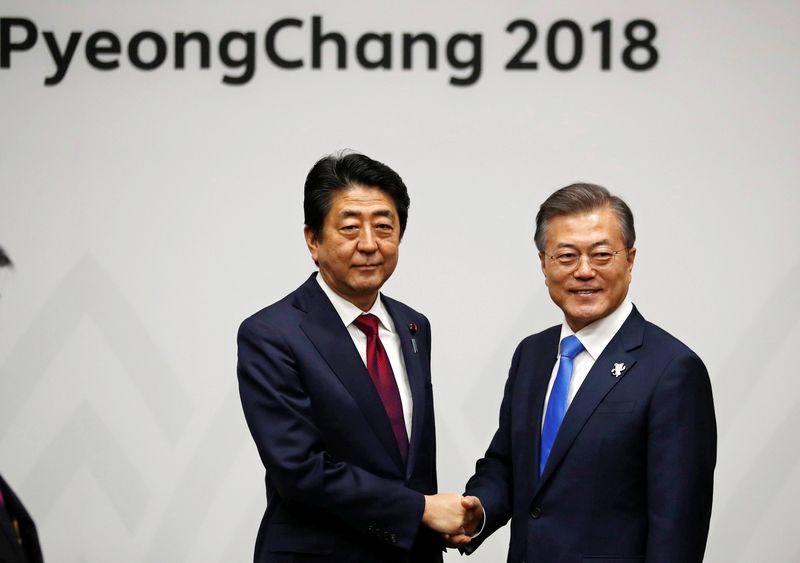 South Korean President Moon Jae-in shakes hands with Japanese Prime Minister Shinzo Abe during their meeting in Pyeongchang, South Korea, February 9, 2018. u00e2u20acu201d Reuters pic