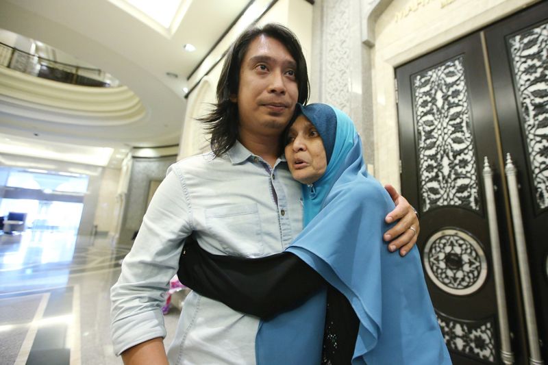 Social activist Adam Adli (left) is pictured at the Palace of Justice, Putrajaya  on February 22, 2018. — Picture by Azinuddin Ghazali