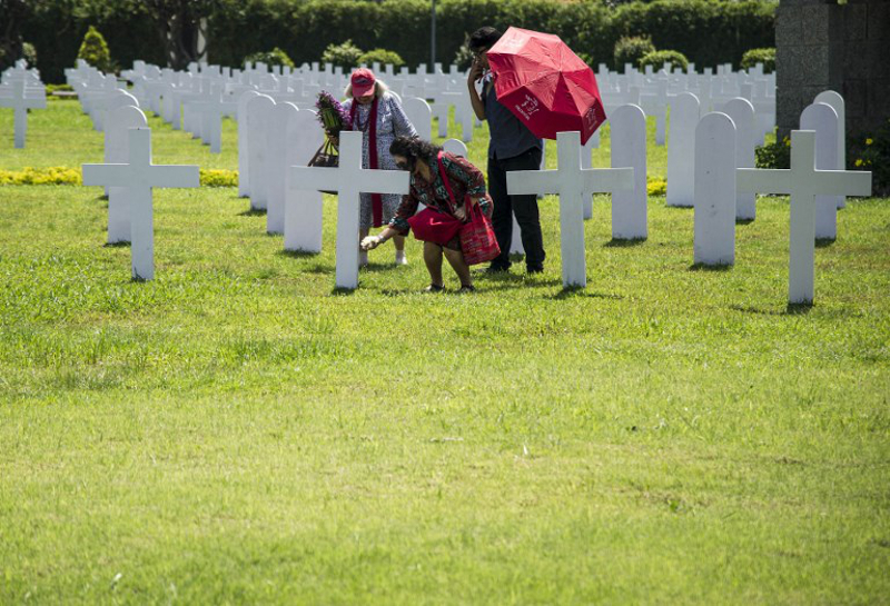 Family members pay their respects to the 915 Dutch soldiers killed in the battle of the Java Sea at the Dutch war cemetery Ereveld in Surabaya on February 27, 2018. u00e2u20acu201d AFP pic
