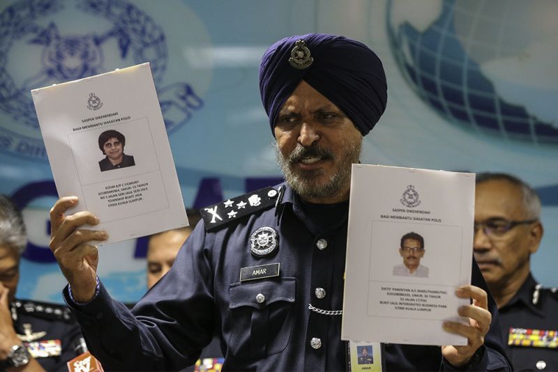Datuk Seri Amar Singh Amar shows the photofits of the two prime suspects in the FX United forex investment scam, Datuk M. Pandeyan and his wife Datin CF Gouri, February 14, 2018. u00e2u20acu2022 Picture by Azneal Ishak