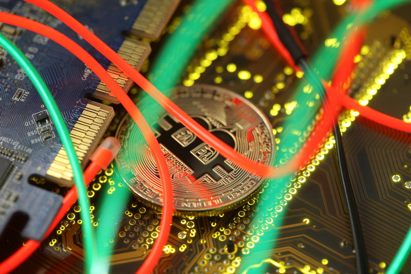 Representation of the Bitcoin virtual currency standing on the PC motherboard is seen in this illustration picture, February 3, 2018. u00e2u20acu201d Reuters pic