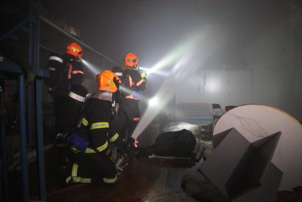 SCDF personnel work to put out a fire at a warehouse located in Ubi Ave 4 at 2am on Feb 27, 2018. u00e2u20acu201d Picture courtesy of SCDF