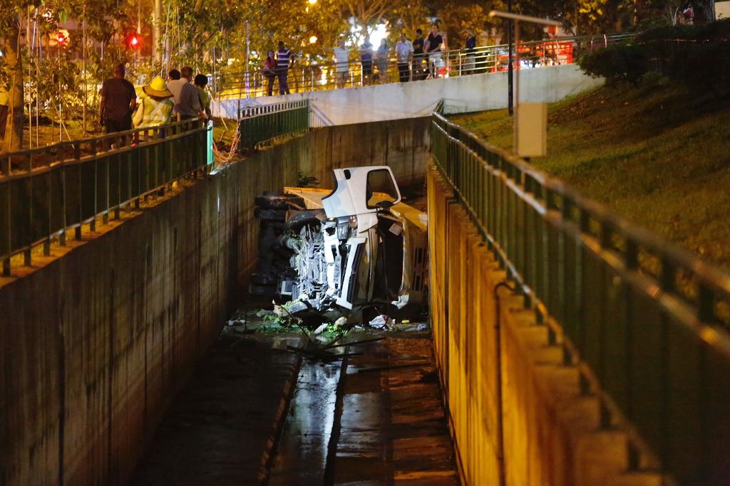 A man was conveyed to the Singapore General Hospital on Wednesday afternoon after he lost control of his vehicle, which plunged into a canal along Lower Delta Road. u00e2u20acu201d Picture by Raj Nadarajan/TODAY pic