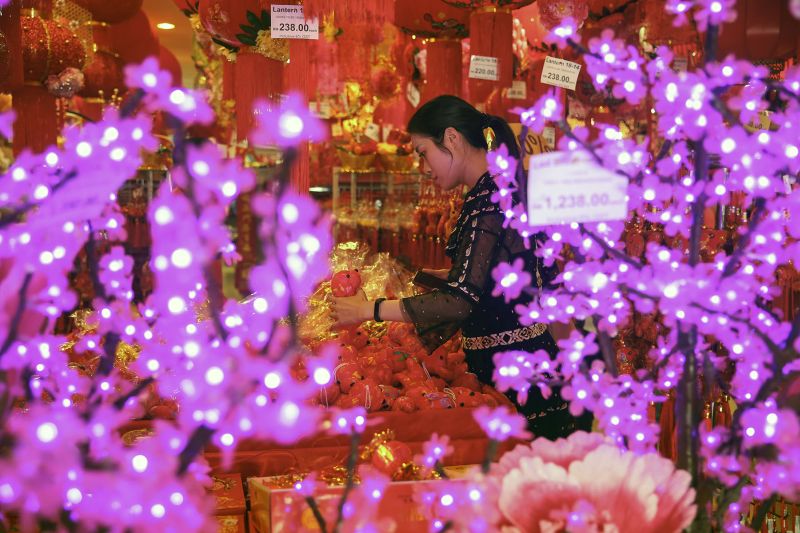 A customer shops for decorations ahead of the Chinese New Year celebrations in Kuala Lumpur February 3, 2018. u00e2u20acu201d Picture by Yusof Mat Isa