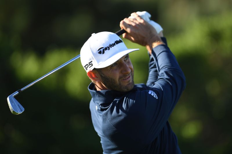 Dustin Johnson tees off on the fifth during the first round of the AT&T Pebble Beach Pro-Am golf tournament at Spyglass Hill Golf Course. u00e2u20acu2022 Reuters pic