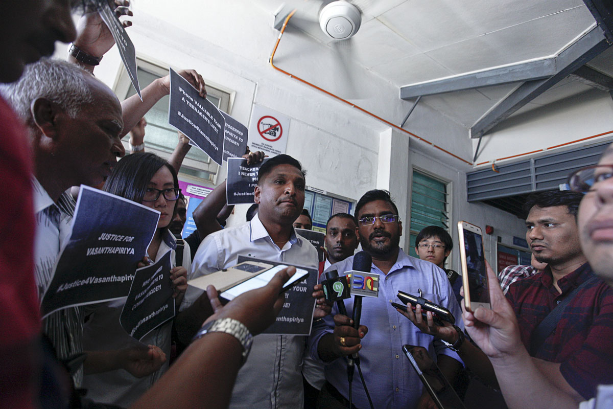 Seberang Jaya Municiple Council member David Marshel (third left) and M. Satees (fourth left) speaks to the press at the Mortuary Department in Seberang Jaya Hospital yesterday. u00e2u20acu201d Picture by Sayuti Zainudin 