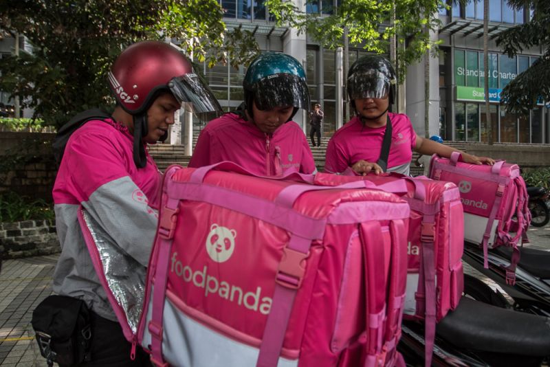 Food Panda riders prepare to deliver their orders in Klang Valley. ― Picture by Shafwan Zaidon
