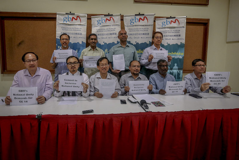 Gabungan Bertindak Malaysia (GBM) committee members hold signs during a press conference in Kuala Lumpur February 7, 2018. u00e2u20acu201d Picture by Firdaus Latif