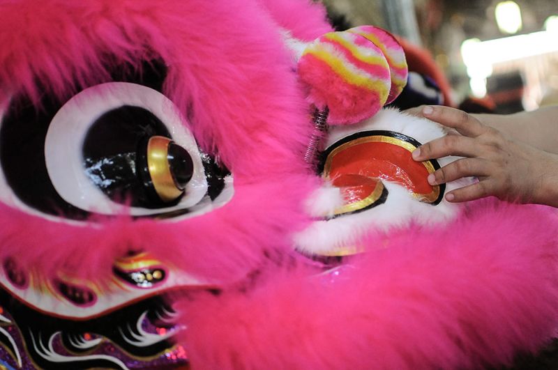 A worker putting on the finishing touches a u00e2u20acu02dclion headu00e2u20acu2122 in a factory ahead of the Chinese New Year celebration, in Subang Jaya February 11, 2018. u00e2u20acu2022 Picture by Miera Zulyana