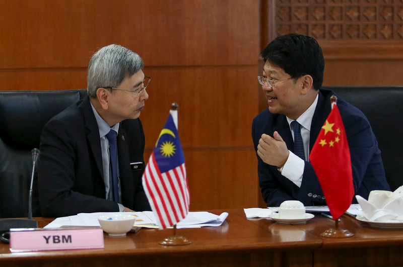 Minister of Plantation Industries and Commodities Datuk Seri Mah Siew Keong (left) and China Ambassador to Malaysia Bai Tian chats before a joint press conference in Putrajaya  February 2, 2018. u00e2u20acu201d Picture Yusof Mat Isa