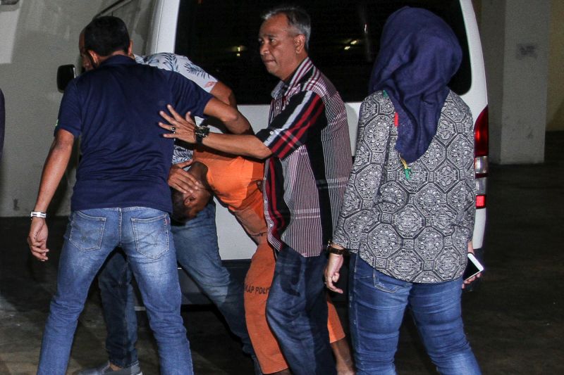 A 37-year-old self-confessed killer is seen leaving the Petaling Jaya Magistrates Court February 6, 2018. u00e2u20acu201d Picture by Shafwan Zaidon