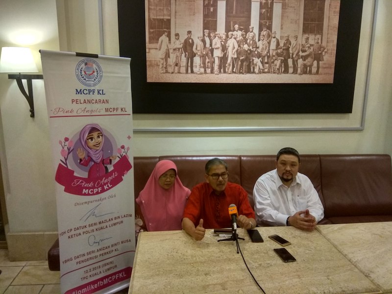 Pink Angels patron and PERKEP KL (Malaysian Police's Wives and Families Association) chairperson Datin Seri Anizah Musa, Mazlan and MCPF KL chairman Bok Siew Mun during the launch today. u00e2u20acu201d Picture by Kenneth Tee