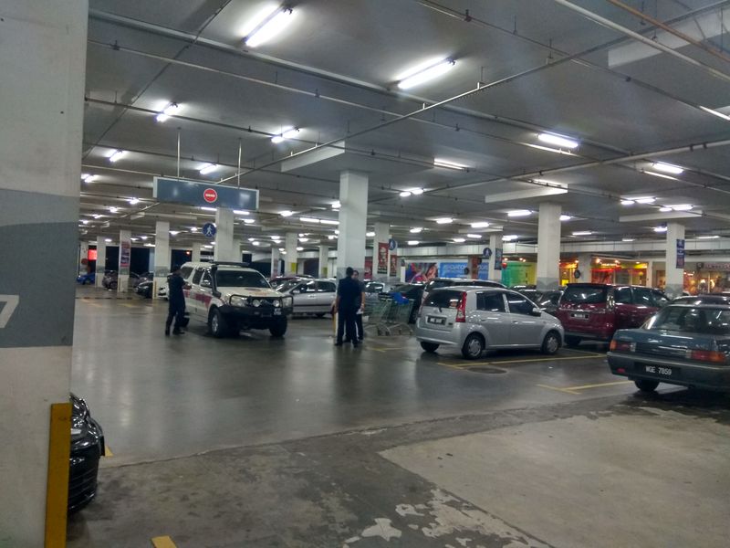 A police forensic team arrives at the location where the murder allegedly has taken place inside in a car parked in Kota Damansara, February 5, 2018. The car was parked in between the Perodua Viva and Proton Saga. u00e2u20acu201d Picture by Kenneth Tee