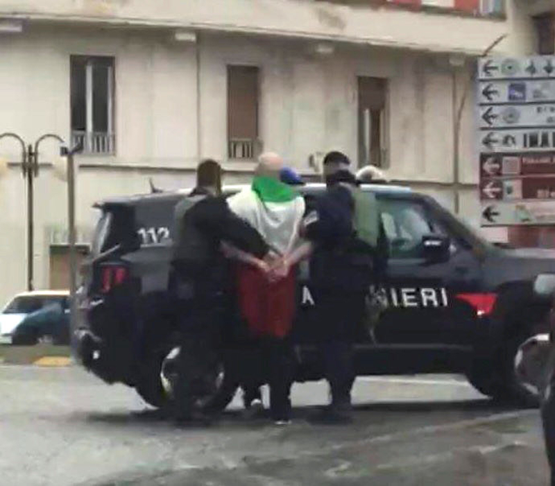The suspected shooter that opened fire on African migrants, identified as Luca Traini, 28, is seen detained by Italian Carabinieri in Macerata February 3, 2018. u00e2u20acu201d Picture by Italian Carabinieri via Reuters