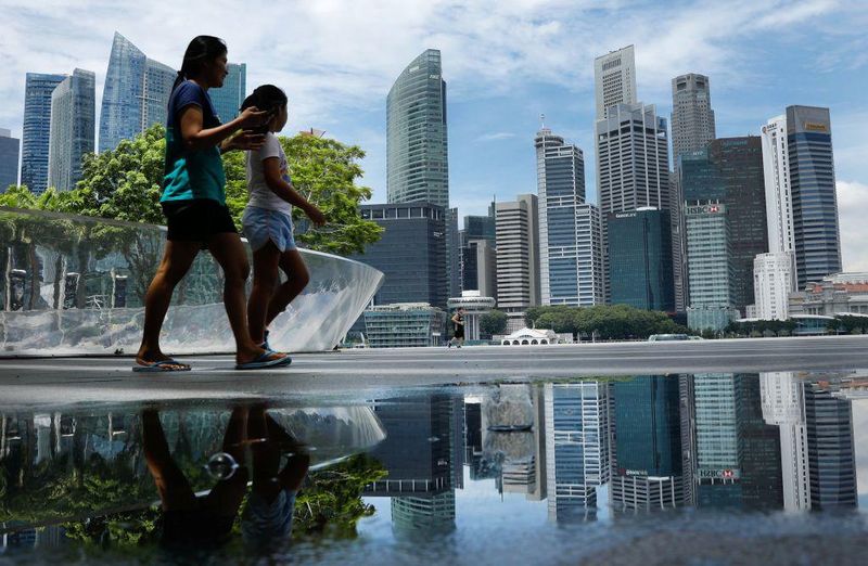 Every Singaporean aged 21 years and above this year will receive a one-off payment of up to S$300 from the Government, as the Republic expects a record largest surplus for the current financial year. u00e2u20acu201d TODAY file pic