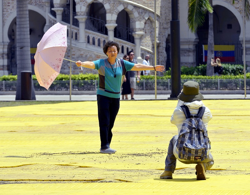Tourists from China pose for pictures as they visit Dataran Merdeka in Kuala Lumpur February 16 2018. u00e2u20acu201d Picture by Ham Abu Bakar