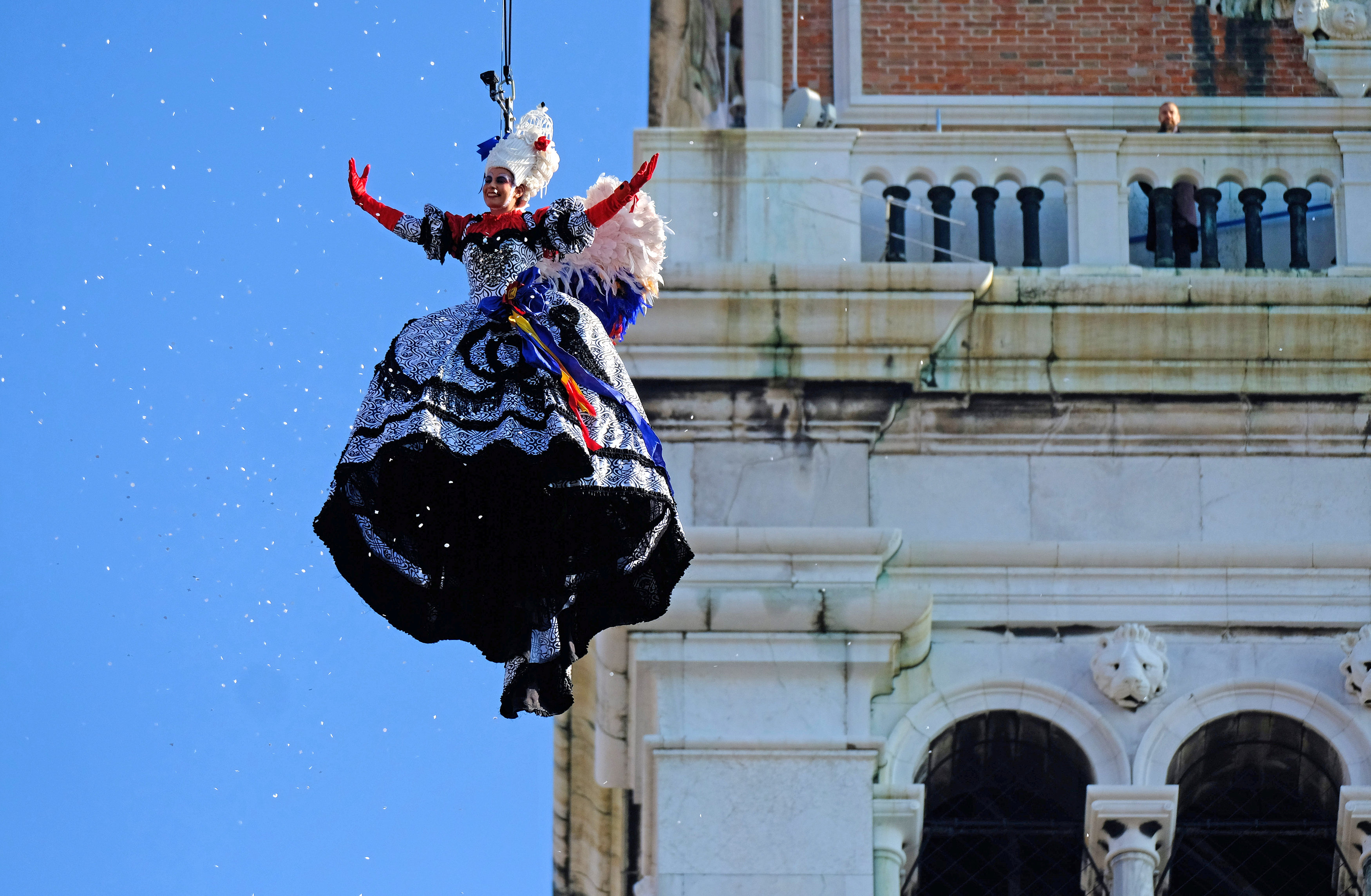A woman dressed as an 'angel' descends on Saint Mark's Square during the Venice Carnival, Italy, February 4, 2018. u00e2u20acu201d Reuters pic 
