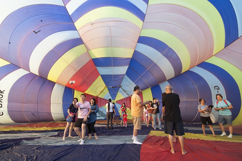 Visitors taking selfies in front of a hot air balloon. u00e2u20acu201d Pictures by KE Ooi