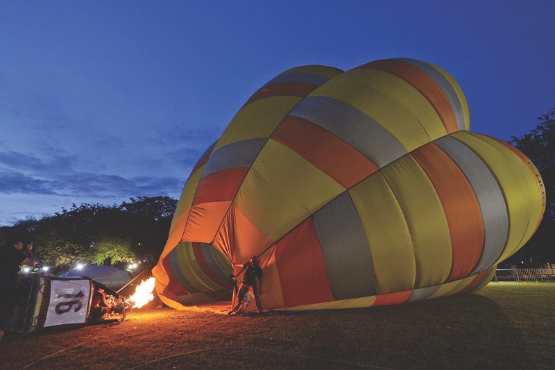 A hot air balloon being inflated before the crowd poured in.