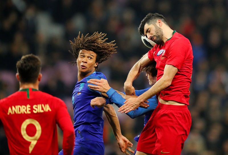Netherlands' Nathan Ake in action with Portugal's Luis Neto during the international friendly at Stade de Geneve in Geneva March 26, 2018. u00e2u20acu201d Reuters pic