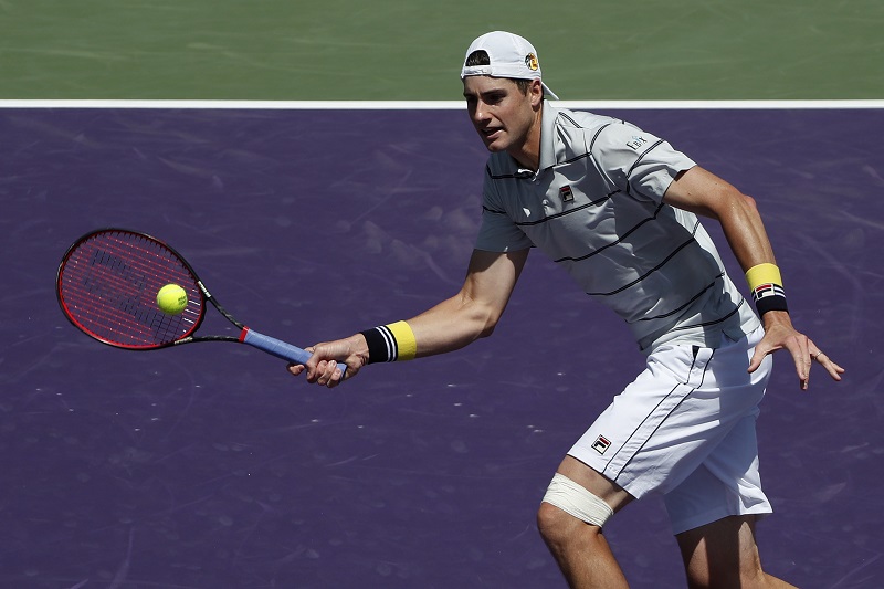 John Isner  hits a volley against Marin Cilic (not pictured) on day eight of the Miami Open at Tennis Center at Crandon Park, Miami March 27, 2018. u00e2u20acu201d Picture by  Geoff Burke-USA TODAY Sports via Reuters