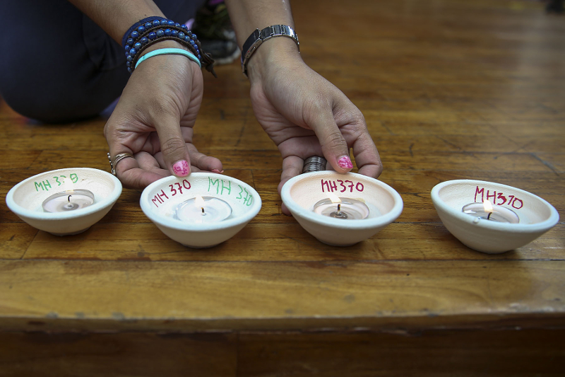 Family members and relatives of the passengers of flight MH370 light candles during the 4th annual remembrance event at the Publika in Kuala Lumpur March 3, 2018. u00e2u20acu201d Picture by Yusof Mat Isa