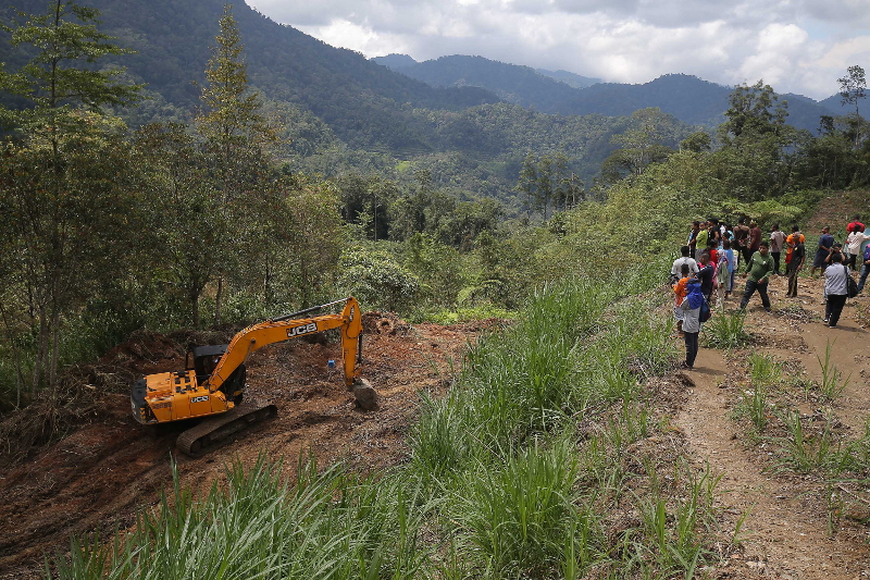 An excavator at work clearing land at Kampung Yess near Simpang Pulai. Villagers are appealing to the Perak state government to stop the agro farming and agro tourism project which they say will affect their livelihood. u00e2u20acu201d Picture by Marcus Pheong