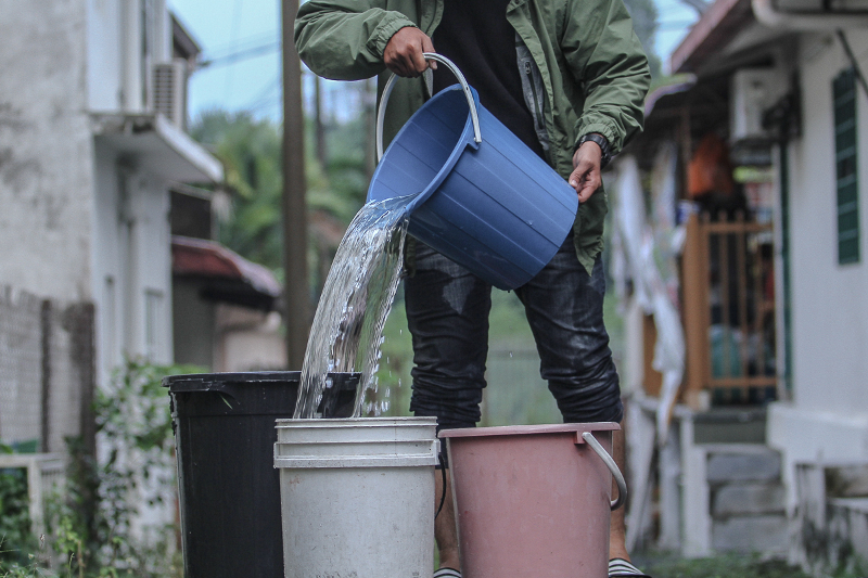A resident of Taman Cheras Indah fills a bucket with water as a preparation of water disruption in Klang Valley March 5, 2018. u00e2u20acu201d Picture by Shafwan Zaidon