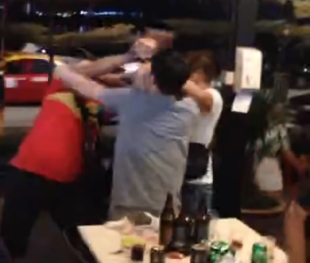 A four-minute-26-second video showed a group of people arguing about a Vietnamese woman before the scene devolved into a melee of punches, smashed bottles and thrown chairs.