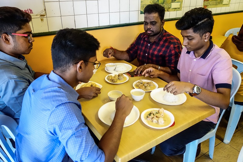 Gold Chilli customers having their lunch served on paper plates due to the water disruption in Subang Jaya.
