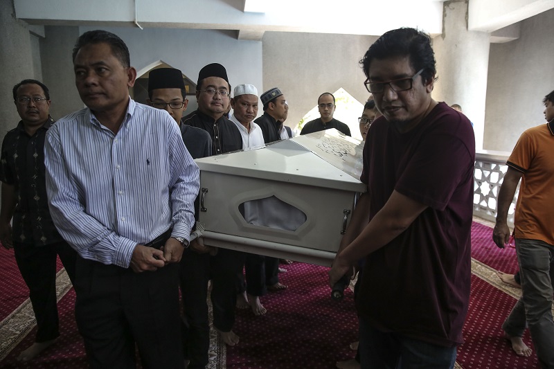 The coffin bearing the body of Tan Sri Sanusi Junid is carried out of Saidina Umar Al Khattab Mosque in Kuala Lumpur March 9, 2018. u00e2u20acu201d Picture by Yusof Mat Isa