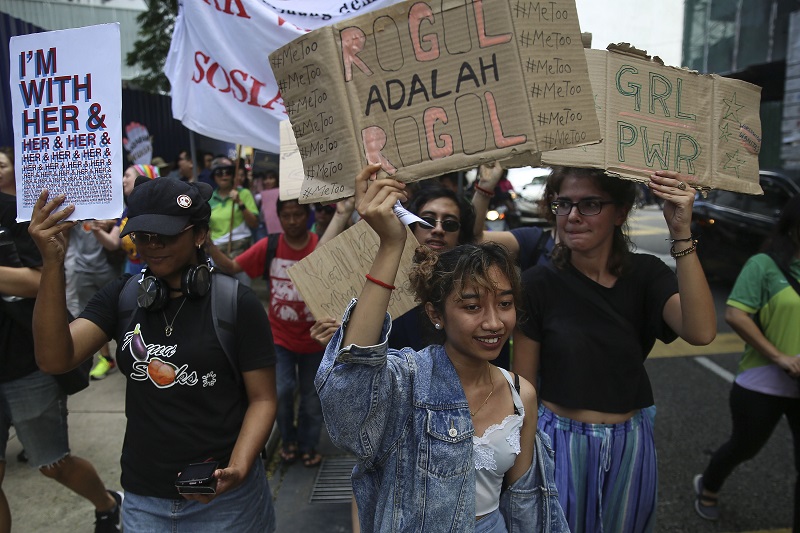 People chant slogans and hold up posters as they take part in a march to commemorate International Women’s Day 2018 in Kuala Lumpur March 10, 2018. 