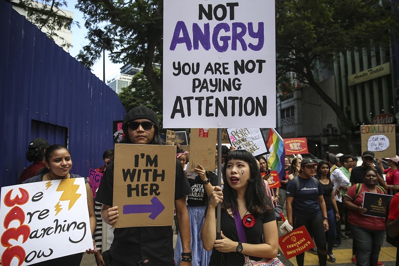People chant slogans and hold up posters as they take part in a march to commemorate International Womenu00e2u20acu2122s Day 2018 in Kuala Lumpur March 10, 2018. u00e2u20acu201d Picture by Yusof Mat Isa