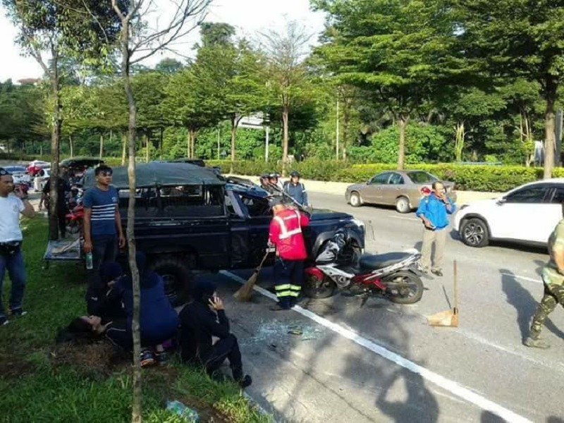 Victims wait for medical attention after the Land Rover they were travelling in crashed and overturned on Jalan Mahameru in Kuala Lumpur March 12, 2018. u00e2u20acu201d Picture via Facebook/Friends of PDRM