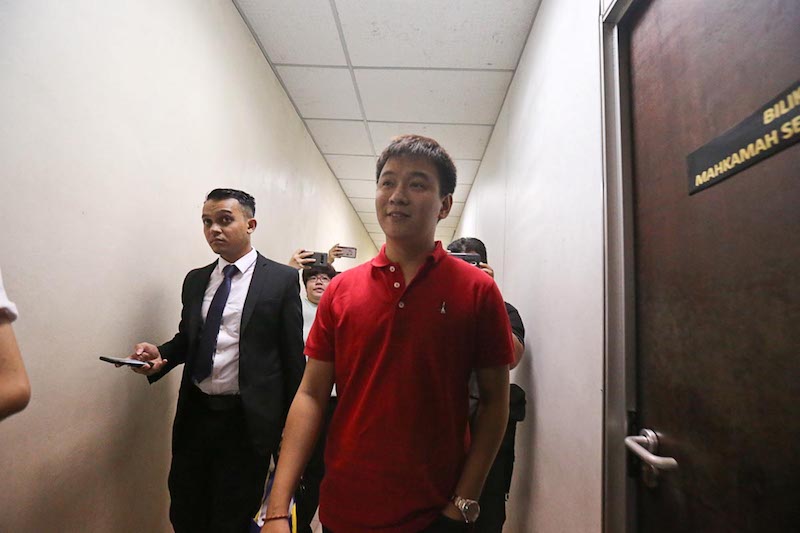 CEO of JJ Global Network Lee Choong Sen is escorted by Companies Commission of Malaysia reps after being charged for providing false information in Butterworth March 13, 2018. u00e2u20acu201d Picture by Sayuti Zainudin