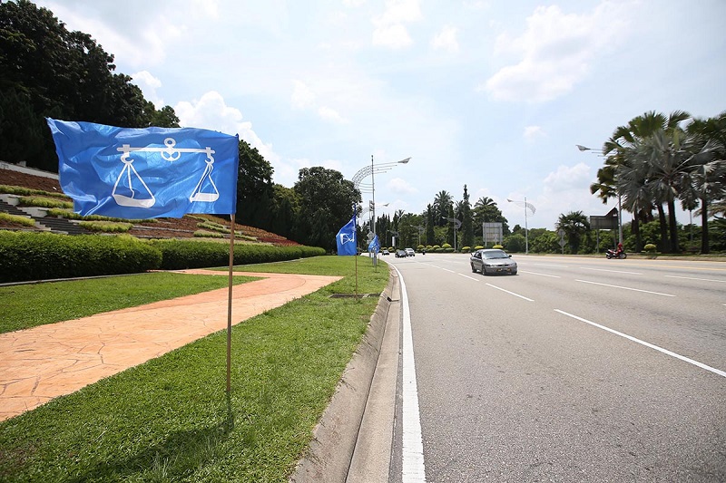 Barisan Nasional flags are seen along a road in Putrajaya March 15, 2018. u00e2u20acu201d Picture by Azinuddin Ghazali