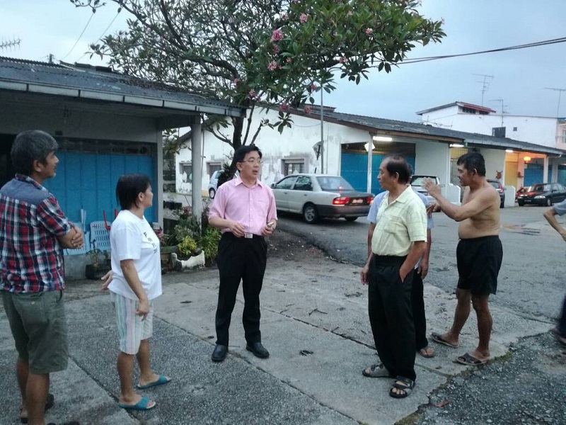 Skudai state assemblyman Dr Boo Cheng Hau (centre) speaks to the residents of Kampung Pouciling in Skudai whose homes were damaged in the freak storm. u00e2u20acu201d Picture courtesy of Skudai state assemblymanu00e2u20acu2122s office 