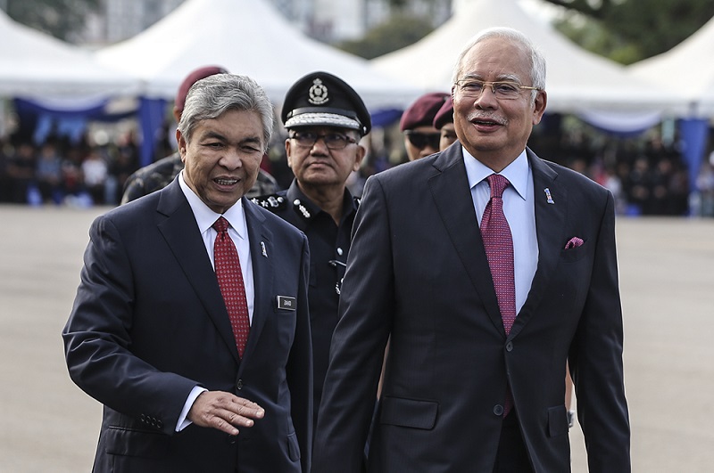 (From left) Deputy Prime Minister Datuk Seri Ahmad Zahid Hamidi, IGP Tan Sri Mohamad Fuzi Harun  and Prime Minister Datuk Seri Najib Razak at the 211th National Day celebration at Pulapol in Kuala Lumpur March 25, 2018. u00e2u20acu201d Picture by Azneal Ishak
